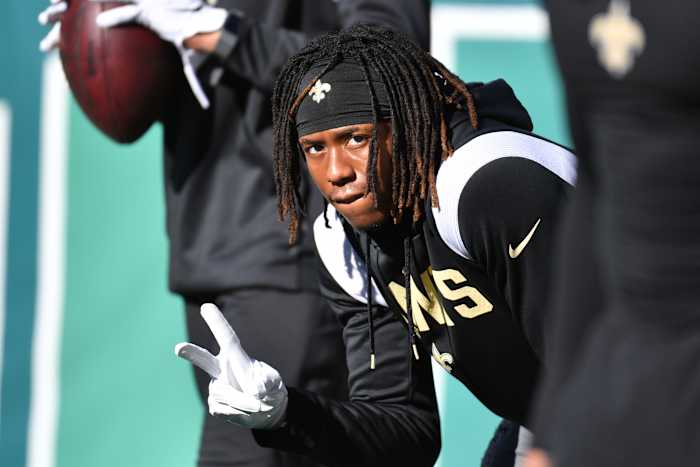 Rashid Shaheed flashes the peace hand sign to cameras before game against the Philadelphia Eagles.